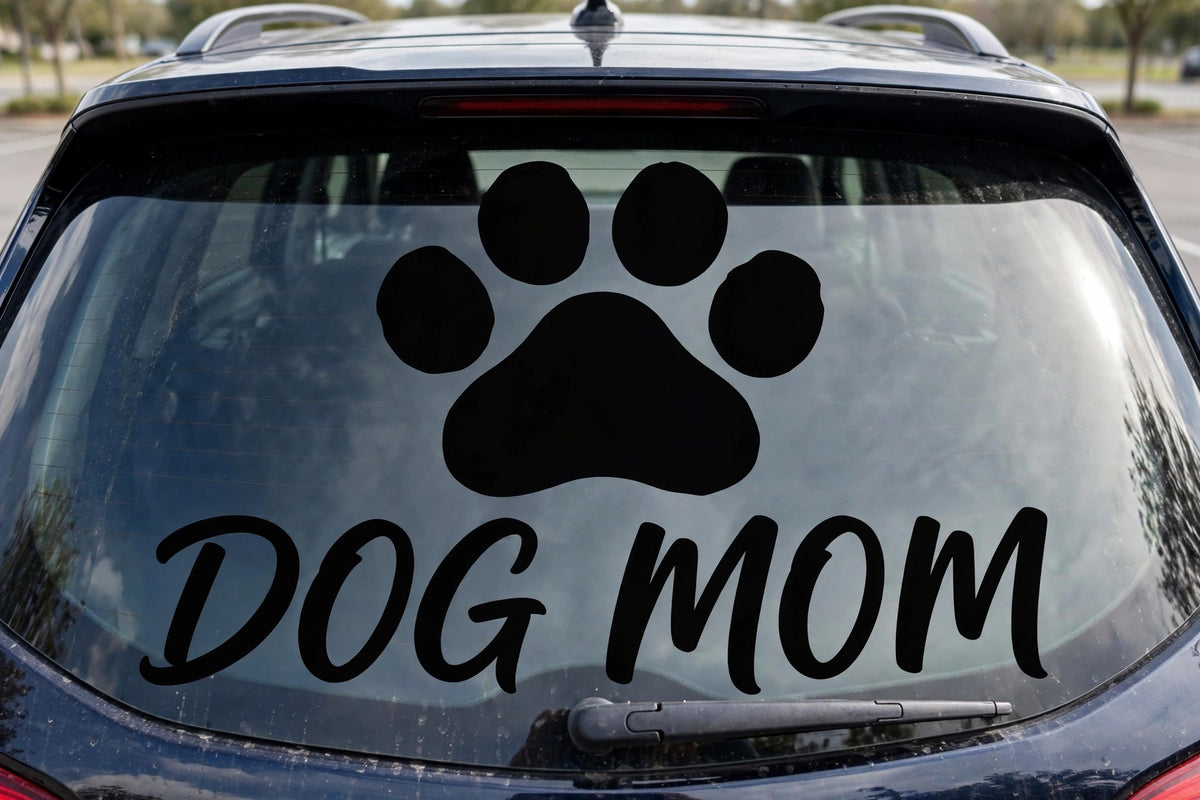 Dog Mom decal applied to a truck rear window