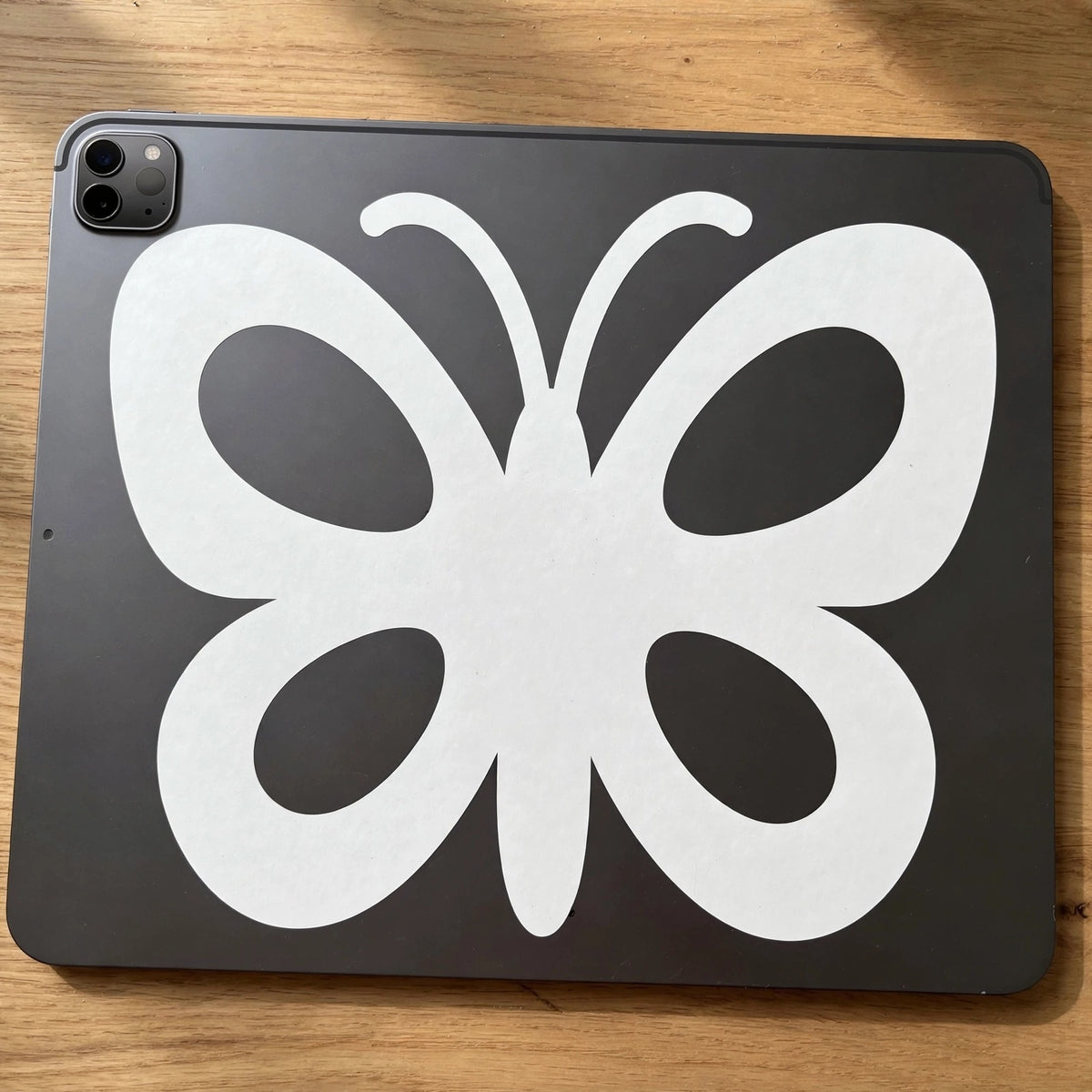 Butterfly decal applied to a tablet back